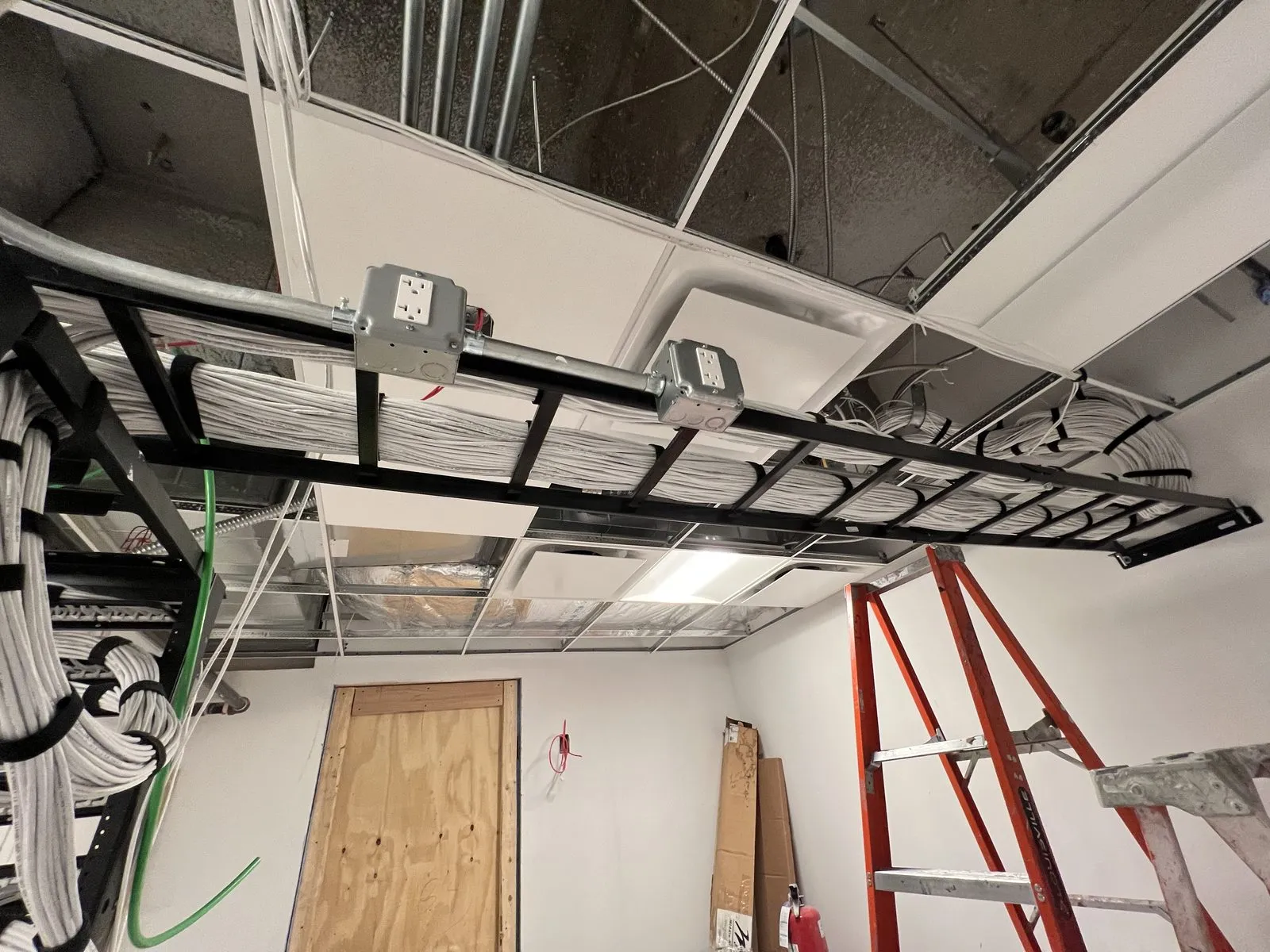 Overhead cable tray with dressed bundles running to IDF